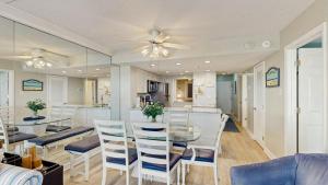 Sunny coastal condo with beach views balcony pools gym sauna & AC