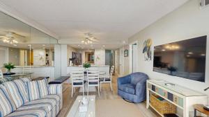 Sunny coastal condo with beach views balcony pools gym sauna & AC