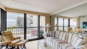 Sunny coastal condo with beach views balcony pools gym sauna & AC