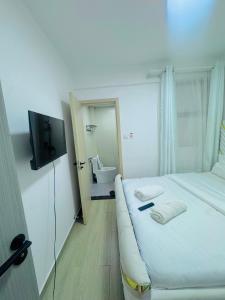 Budget friendly compact studio SQ in westlands With queen size bed fridge tv microwave pool but no cooking