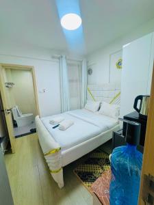 Budget friendly compact studio SQ in westlands With queen size bed fridge tv microwave pool but no cooking