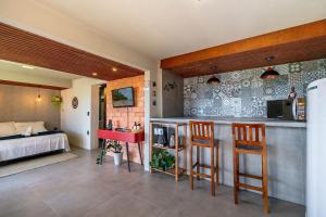Loft Barra da Lagoa com vista by Achei Floripa