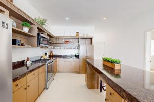 Dog-Friendly Beachfront Retreat with Rooftop Deck, Pool, Hot Tub, & Kitchen
