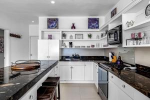 Dog-Friendly Oceanfront Villa with Rooftop Patio, Pool Access, & Kitchen