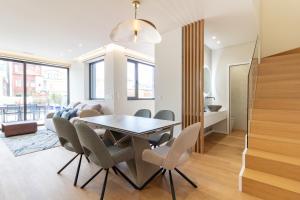 Coastal 3BR Duplex w Terrace by LovelyStay