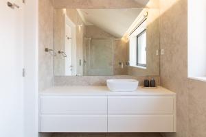 Coastal 3BR Duplex w Terrace by LovelyStay