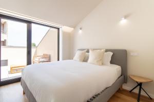 Coastal 3BR Duplex w Terrace by LovelyStay