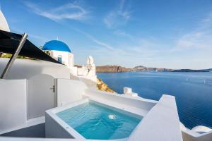 Three Domes Oia - an Iconic Collection