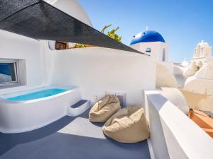 Three Domes Oia - an Iconic Collection