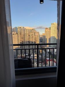 Condo in Red Residences -Self Check-in - Fast Wi-Fi