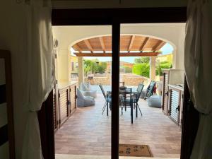 Confortevole Trilocale con ampio Patio, Residence Mirice - Vignola Mare