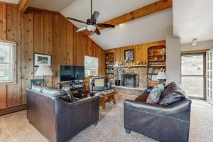 Enjoy Nature from this Charming Cabin with Deck, Fireplace, & Washer and Dryer