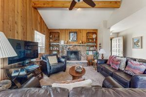 Enjoy Nature from this Charming Cabin with Deck, Fireplace, & Washer and Dryer