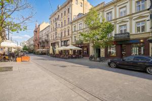 Stylish Apartment with Air Conditioning in the Center of Łódź by Noclegi Renters