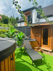Domki Dwa jelonki - balia z jacuzzi i sauna