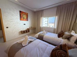 Luxury Appartement Style Côte dIvoire Hyper Centre Agadir Balcon WiFi Mer à 7 Min