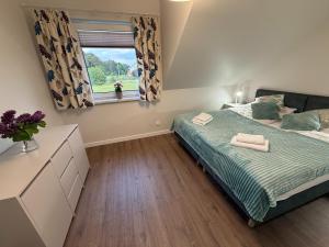 Half of a holiday home with a large garden