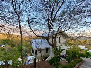 Private home in Playa Potrero near Flamingo with Infinity pool, 9 minute walk to beach, ocean, mountain, nature views, TV and AC in every room