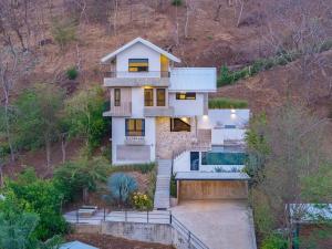 Private home in Playa Potrero near Flamingo with Infinity pool, 9 minute walk to beach, ocean, mountain, nature views, TV and AC in every room
