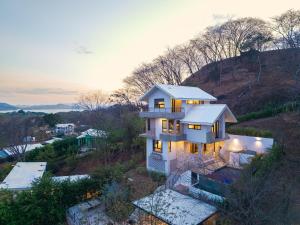 Private home in Playa Potrero near Flamingo with Infinity pool, 9 minute walk to beach, ocean, mountain, nature views, TV and AC in every room