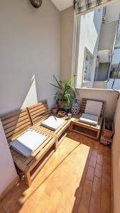 Palms Rooms - Grazioso e Ricercato Trilocale con Veranda a 300m dal mare