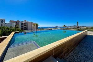 Peaceful Coastal Stay with Pool, Balcony & Fitness Center
