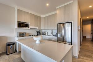 Peaceful Coastal Stay with Pool, Balcony & Fitness Center