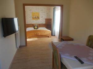 Double Room with Balcony (2 Adults + 1 Child) room in Pension Grünauhof