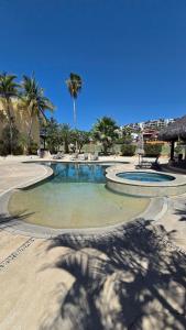 Beautiful house with a pool, golf course, and beach