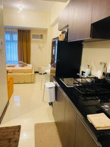 Cozy R&R Suite Aurora Escalades Cubao