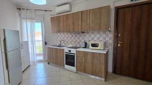 Olive Breeze Apartment 2 by Golden Host