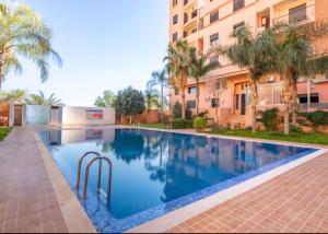 Appartement moderne avec piscine et parking securise