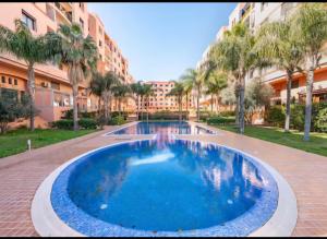 Appartement moderne avec piscine et parking securise