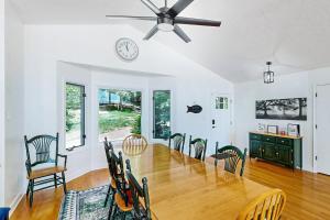 Lakefront home with two kitchens, a dock, firepit, & pontoon