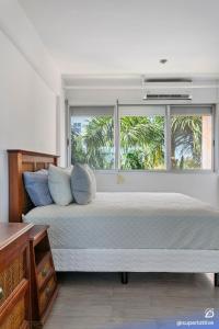 Spacious 2BD with balcony and pool, close to everything