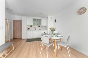 Bright Apartment in Kołobrzeg with Balcony and Parking by Noclegi Renters