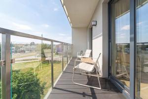 Bright Apartment in Kołobrzeg with Balcony and Parking by Noclegi Renters