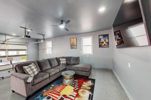 Lakefront home with two kitchens, a dock, firepit, & pontoon