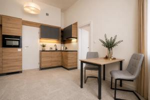 ALURE RESIDENCES 10 - 24h self check-in & private parking next to the apartment building included, CITY CENTER right on SNP Square in a quiet passage, new building, best deal in town
