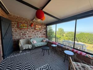 La jolie maison en grès rouge