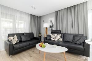 Przytulne i Nowoczesne Apartamenty Sun Seasons 24 w Dziwnowie z Parkingiem by Noclegi Renters
