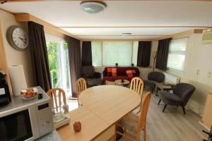 Chalet met Omheinde Tuin nabij Bos I Recreatiepark de Veldkamp