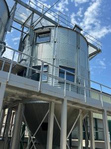 Barley silo on working farm with padel courts