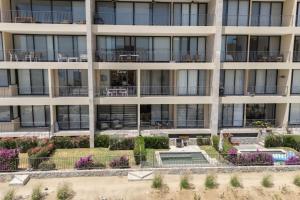 Condo con vista al arco, piscina infinity y spa