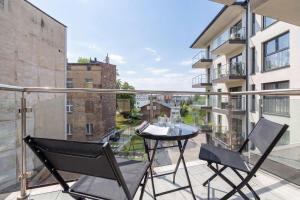 Beige and Pink Apartment in Sosnowiec with Balcony and Desk by Noclegi Renters