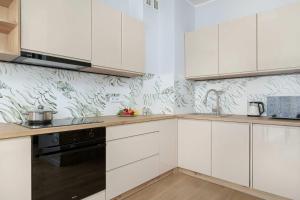 Beige and Pink Apartment in Sosnowiec with Balcony and Desk by Noclegi Renters