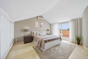 Spacious Penthouse in Elviria with 4 Pools and Large Terrace