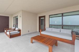 Designer Beachfront Condo with Endless Ocean Views