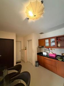 Cosmo Mansion Apartemen