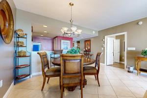 Bright & sleek condo w shared pool fitness center grill area - water views